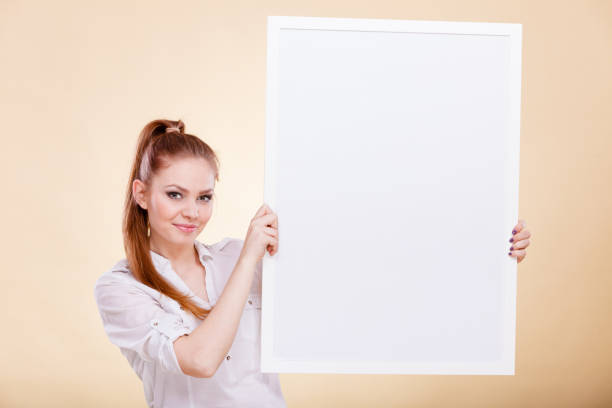 istock Girl with blank presentation board 805015844