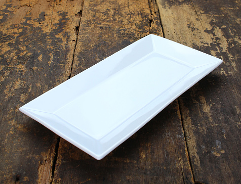 Empty dish plate on wooden background