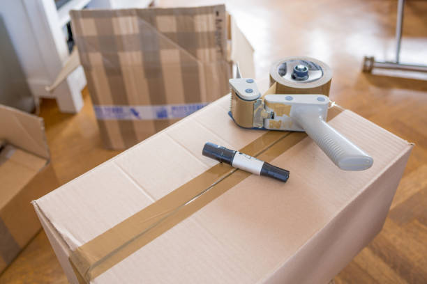 istock House Moving Concept. Closeup of Man Packing Boxes 805020598