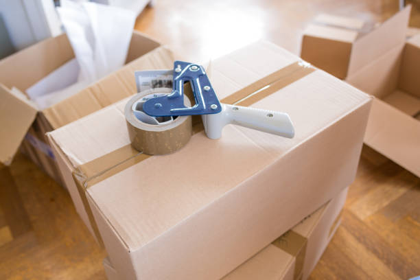 istock House Moving Concept. Closeup of Man Packing Boxes 805020628