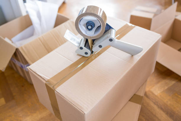 istock House Moving Concept. Closeup of Man Packing Boxes 805020684
