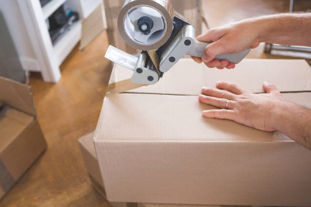 istock House Moving Concept. Closeup of Man Packing Boxes 805020742