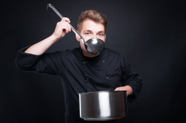 istock Male chef tasting his fresh soup from ladel 805020762