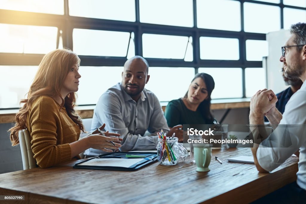 Everyone's opinion gets heard Cropped shot of a group of business colleagues in the office having a meeting and discussing plans for the future Multiracial Group Stock Photo