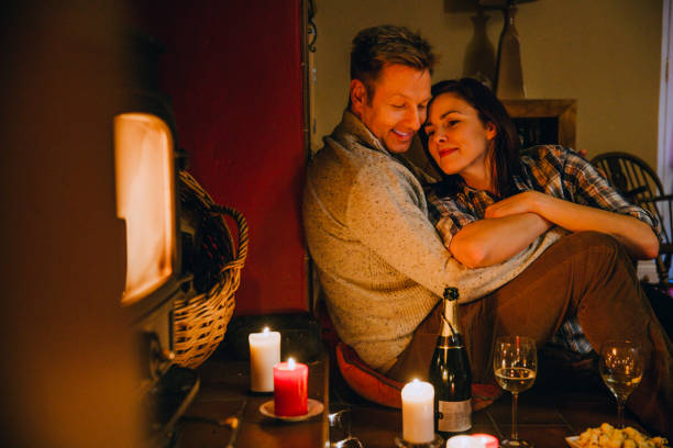 Romantic Mature Couple Relaxing at Home Romantic mature couple relaxing at home. date night romance stock pictures, royalty-free photos & images