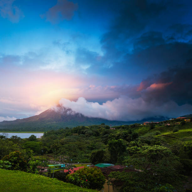 Volcano of Arenal Stormy clouds over volcano of Arenal, Costa Rica costa rican sunset stock pictures, royalty-free photos & images