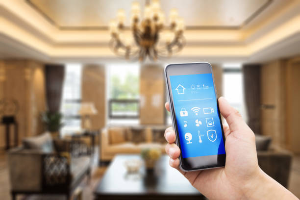 istock mobile phone with living room in smart home 805033696