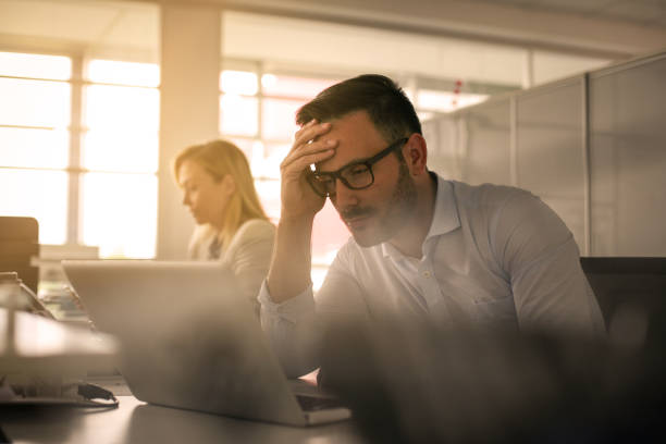istock Business people working in office. Business man having stress in work. 805034062