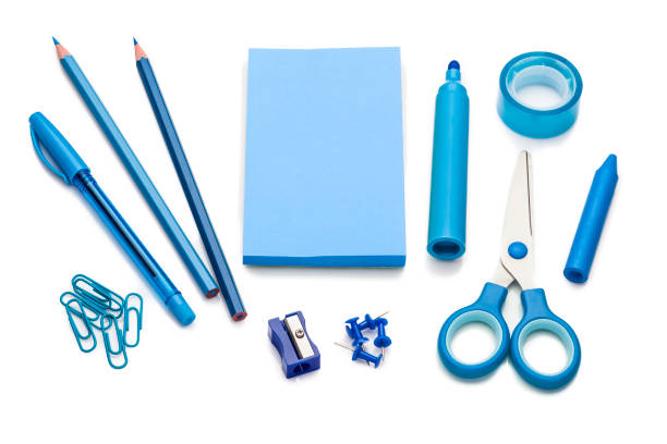 Blue colored office or school supplies on white background