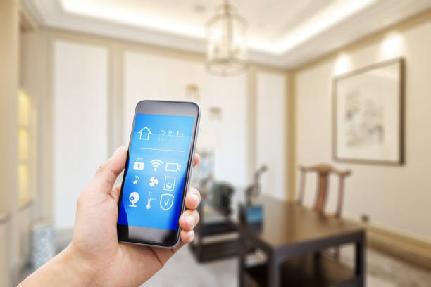 istock mobile phone with living room in smart home 805039234