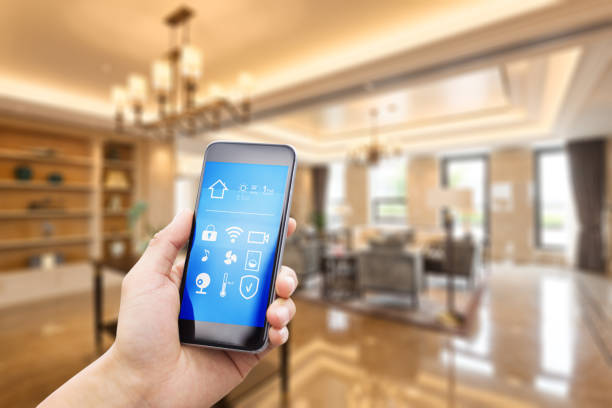 istock mobile phone with living room in smart home 805050764