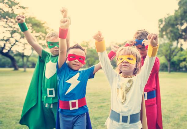 istock Superheroes Cheerful Kids Expressing Positivity Concept 805054040