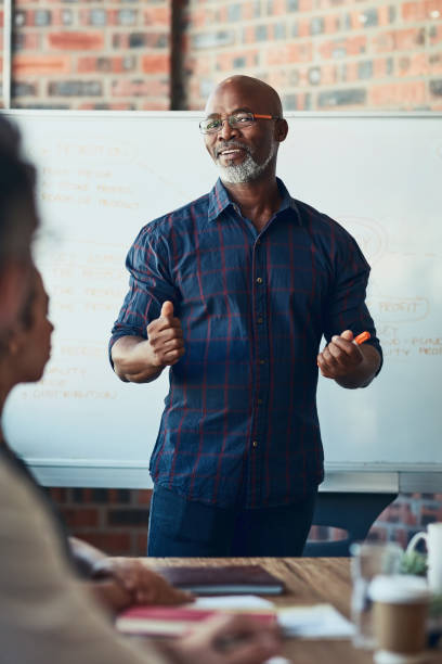 istock Giving them an in-depth explanation 805054594