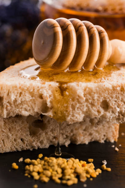 istock Bread and jar of lavender honey 805063814