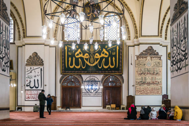 An interior view of Great Mosque (Ulu Cami) Bursa, Turkey - February 04, 2017: An interior view of Great Mosque (Ulu Cami). People are visiting Great Mosque which is the largest mosque in Bursa. ulu camii stock pictures, royalty-free photos & images