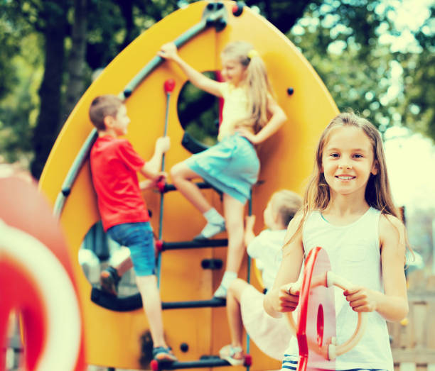 istock Happy girl swinging at playground 805071956
