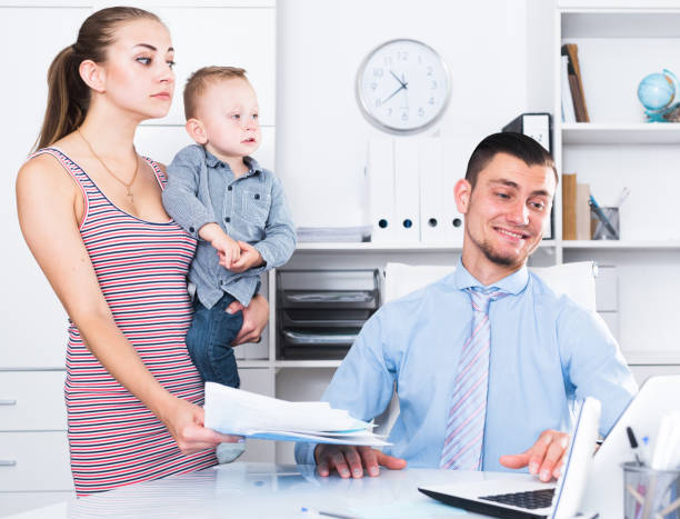 istock manager of insurance company talking with female 805073768