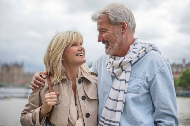 istock Smiling mature couple standing against sky 805085220