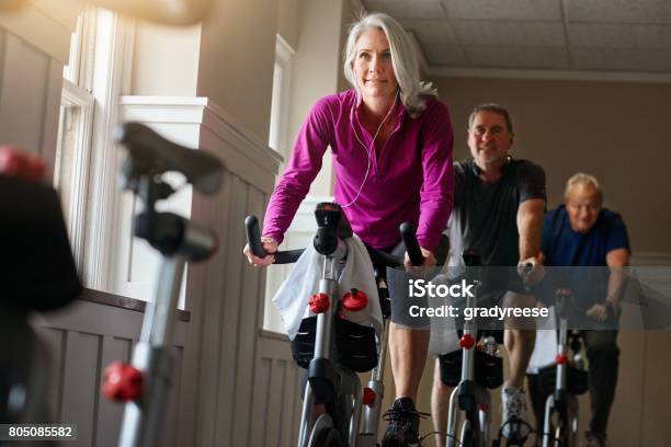 Spin Together To Win Together Stock Photo - Download Image Now - Health Club, Gym, Senior Adult