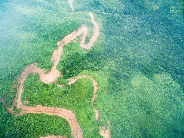 istock curved bad road in mountain view from aerial 805090392