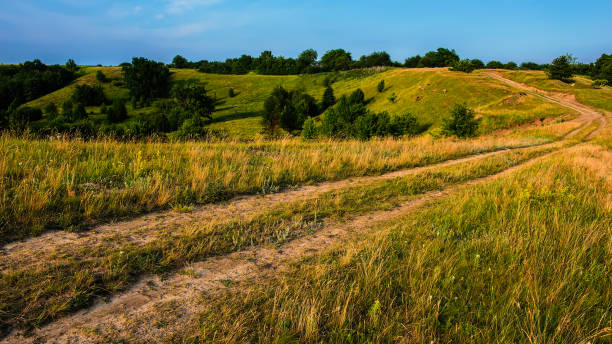 istock Car dirt road on a hillside 805090544