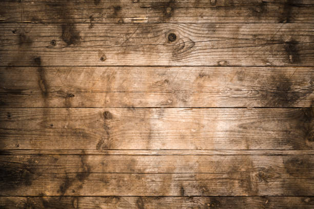 istock Old weathered wood planks background with knots 805109342