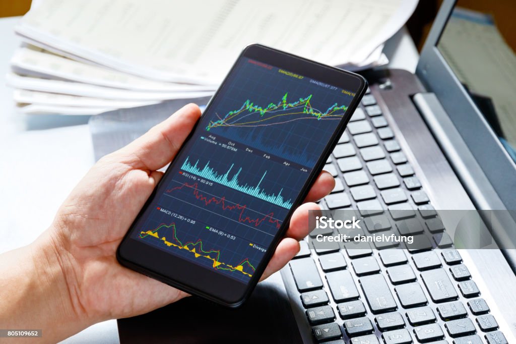 Stock market data on moblie phone Stock Market and Exchange Stock Photo