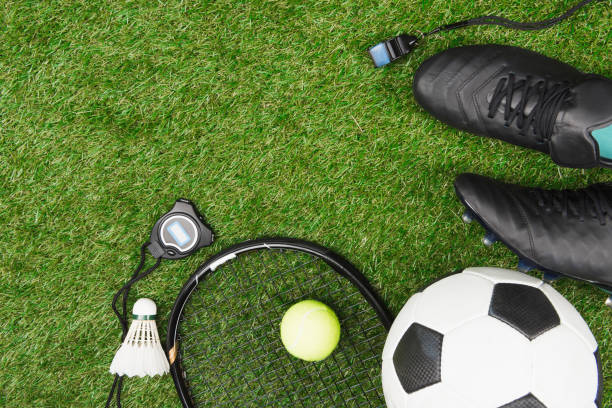 istock Top view of various sport equipment on green grass 805110102