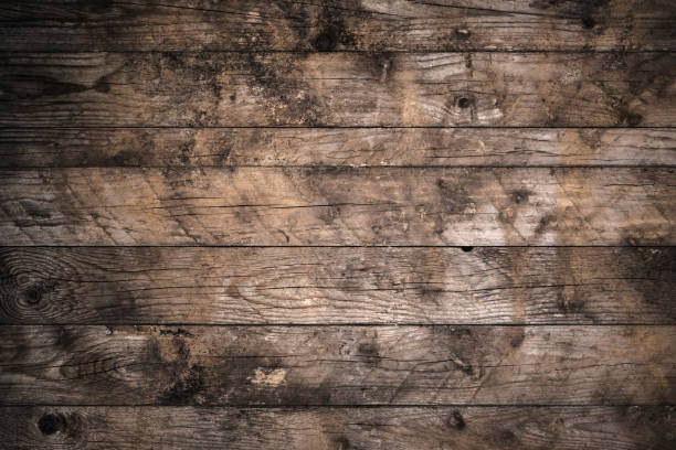 istock Old weathered wood planks background with knots 805110332