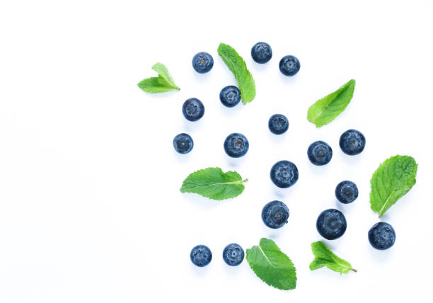 istock Berries of blueberries with mint leaves on a white background 805131690