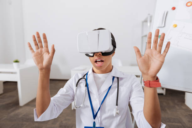 istock Pleasant beautiful woman pressing hands to the virtual screen 805147812