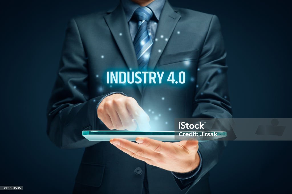 Industry 4.0 - automation, robotics and data exchange in manufacturing technologies Industry 4.0 - automation, robotics and data exchange in manufacturing technologies. Smart factory concept. Computer-Aided Manufacturing Stock Photo