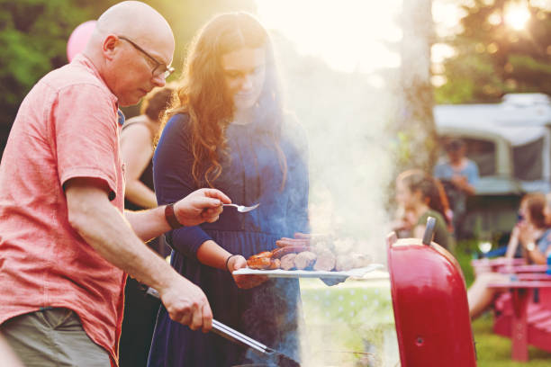 istock Father and daughter cooking on barbecue 805152254