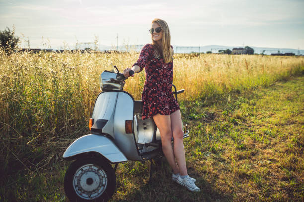 istock Woman in the field with scooter 805166030