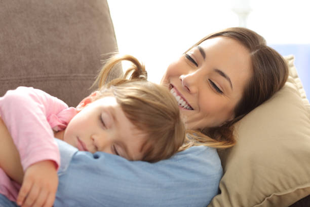 istock Proud mother watching her baby sleeping 805167996