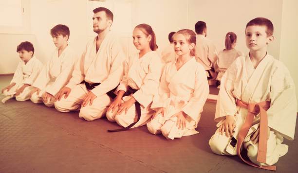 istock Happy children enjoying their trainings with coach at karate class 805183786
