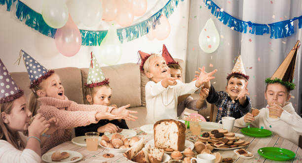 istock smiling children having a good time at a birthday party 805184342