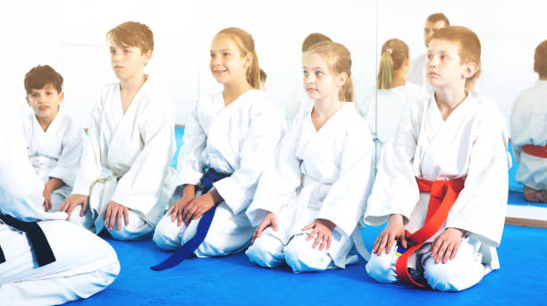 istock Children enjoying their trainings with coach at karate 805188052