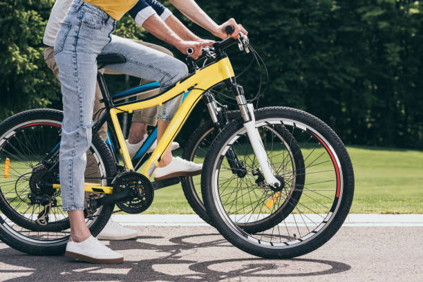 istock cropped shot of couple riding bicycles together in park 805196470