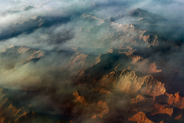 Smoke and haze from a wildfire drifts through the high peaks of the Seirra Mountain Range in California