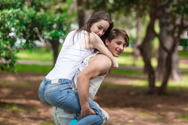 istock Young couple at the park doing a piggyback ride 805206740