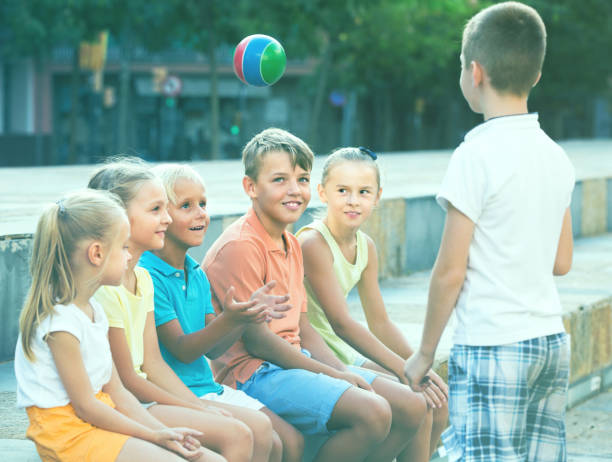 istock kids playing ball together 805207446