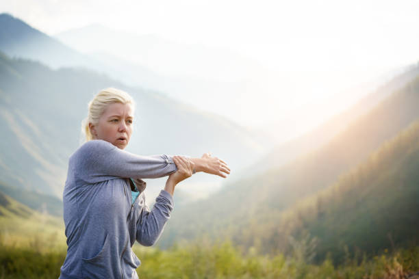 istock Woman stretching arms before exercise. 805218296