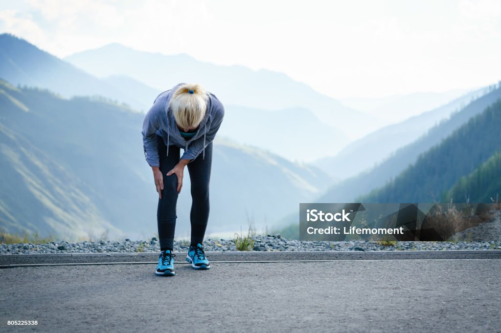 Injuries - sports running knee injury on woman. Injuries - sports running knee injury on woman Knee Stock Photo