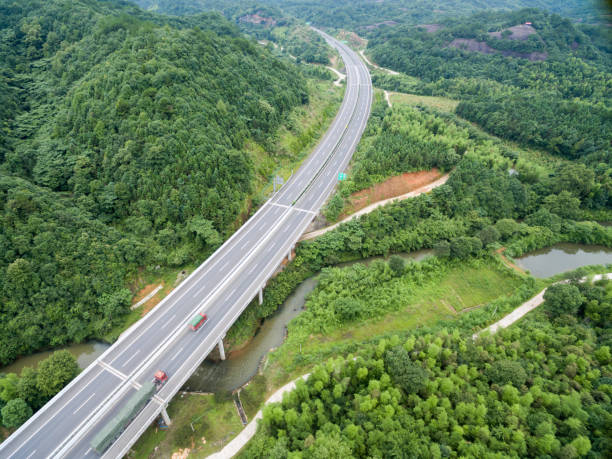 istock aerial view of highway go through mountains 805227434