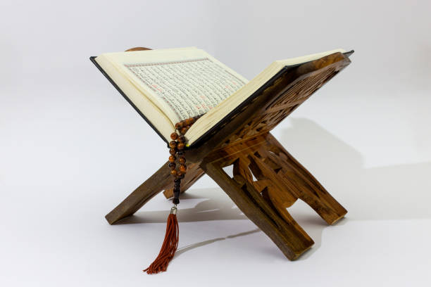 istock Quran on wood stand 805227594
