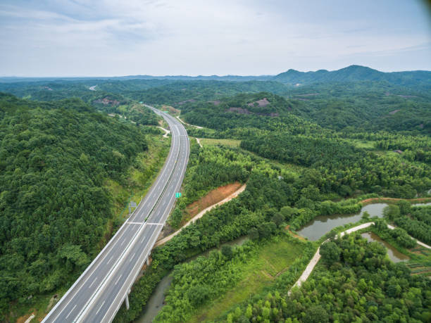 istock aerial view of highway go through mountains 805232544