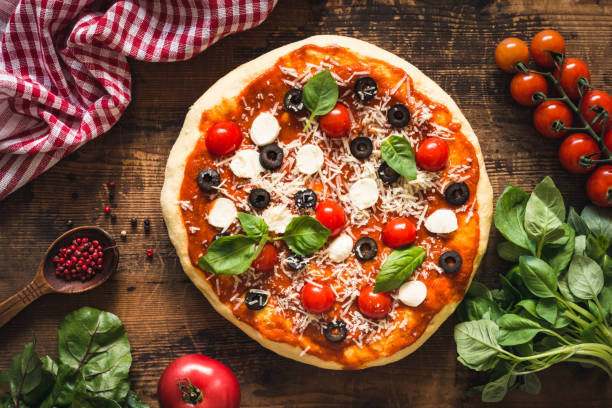 istock Hot italian pizza on wooden table 805255448
