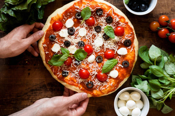 istock Hot italian pizza on wooden table 805255768