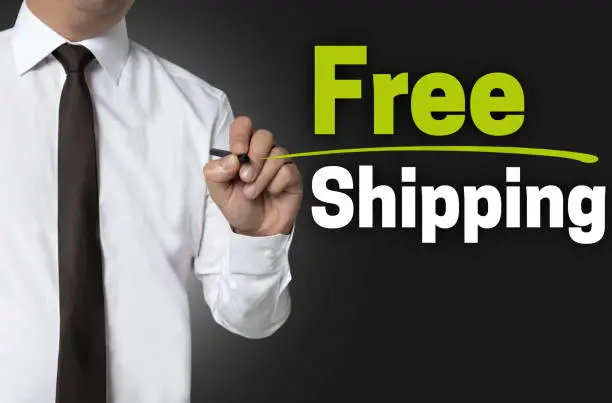 Free shipping will be written by businessman background concept.